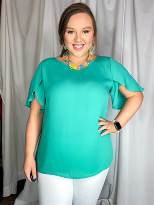 This teal top is designed to have a lose fit with a light, airy sleeve perfect for those breezy spring days ahead, and runs true to size! 