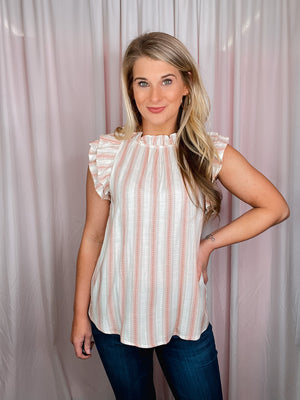 The Casual Chic Top is the perfect way to look fashionable without sacrificing comfort. Crafted from lightweight fabric and styled with short sleeves, a round neckline, and subtle striped details, this top offers an elegant look and feel. Elevated further by ruffle sleeves, the Casual Chic Top is sure to be a wardrobe staple.-sienna