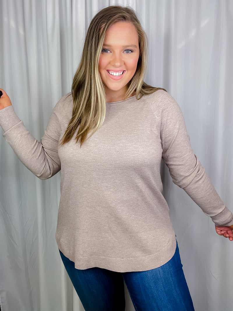 Top features a deep taupe color, dreamy soft material, long sleeves, boat neck line, hi-low hem and runs true to size! 