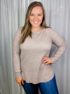 Top features a deep taupe color, dreamy soft material, long sleeves, boat neck line, hi-low hem and runs true to size! 