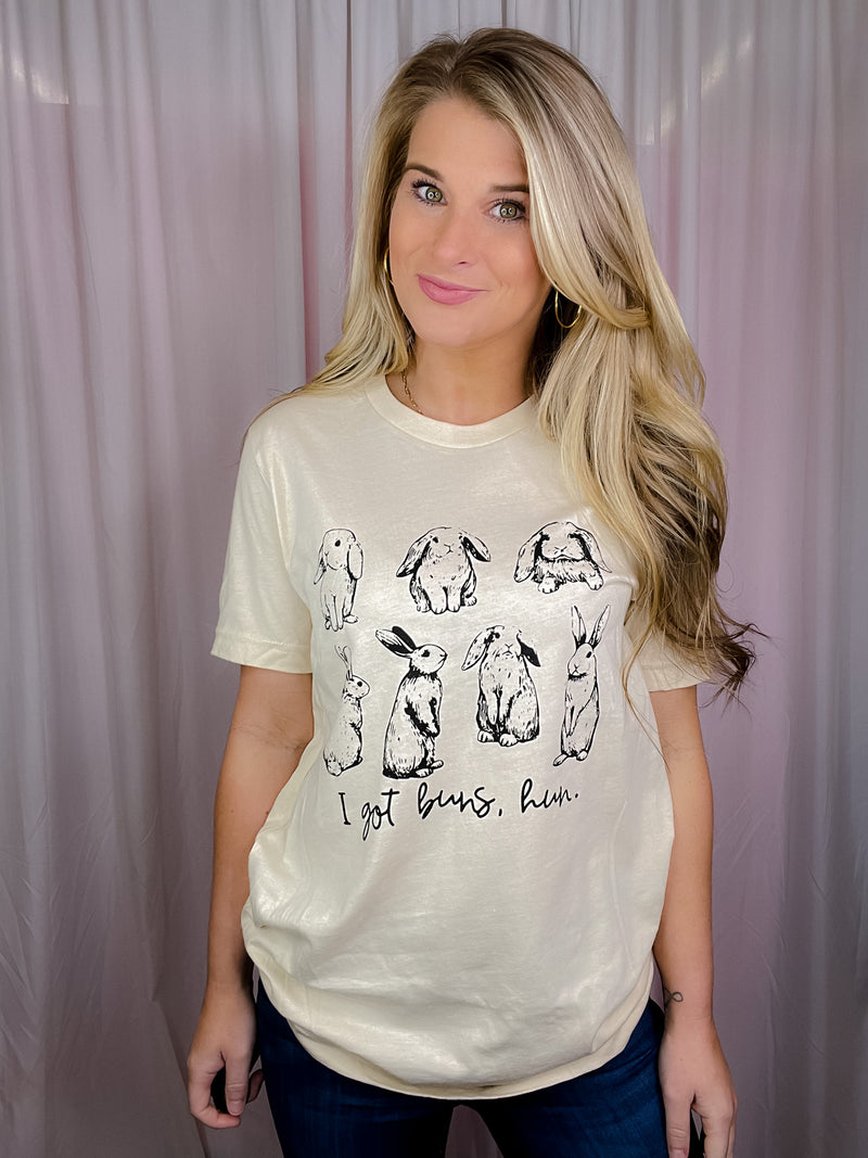 This I Got Buns Hun Tee is perfect for Easter! It features short sleeves, a round neckline, and an unisex fit, plus a playful bunny motif. The phrase 'Got Buns Hun' adds a fun, festive vibe. Get one now in sizes S-3XL!-oatmeal