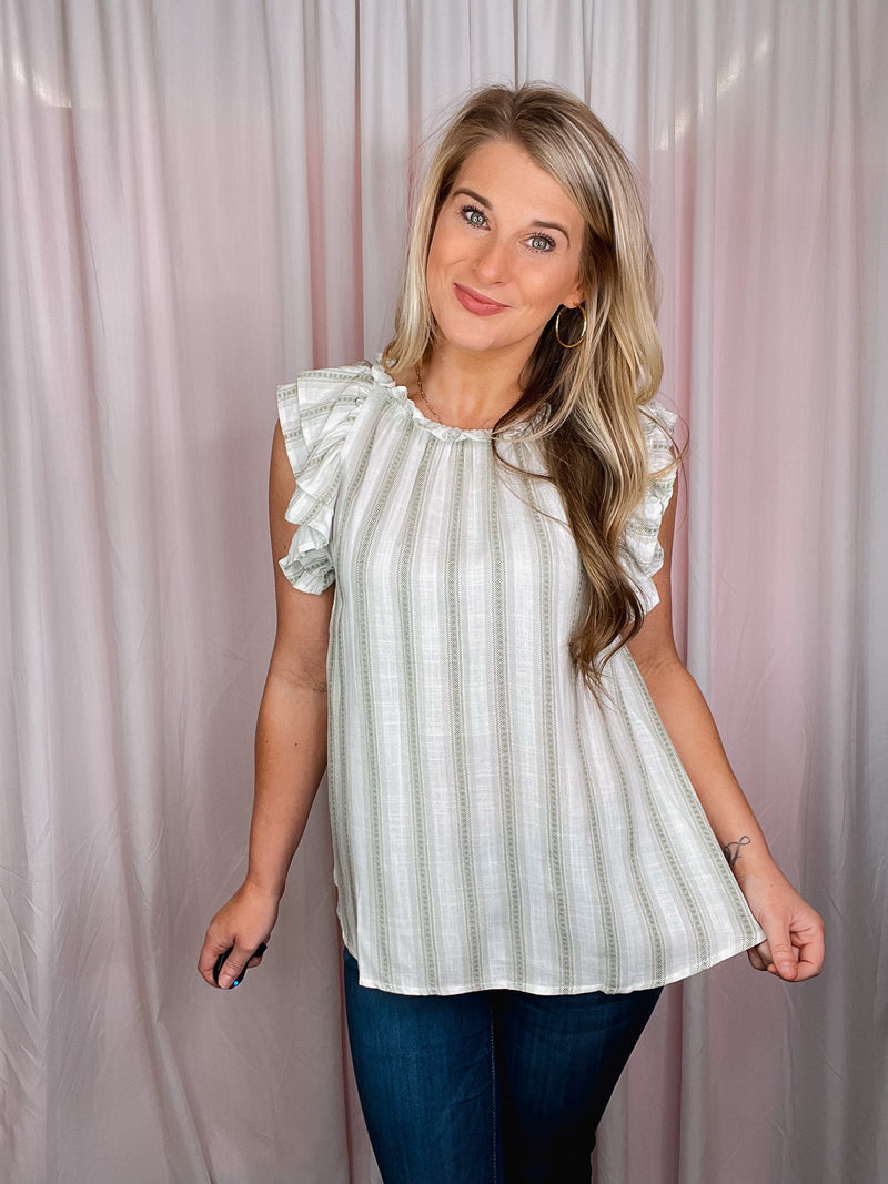 The Casual Chic Top is the perfect way to look fashionable without sacrificing comfort. Crafted from lightweight fabric and styled with short sleeves, a round neckline, and subtle striped details, this top offers an elegant look and feel. Elevated further by ruffle sleeves, the Casual Chic Top is sure to be a wardrobe staple.-olive