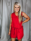 Set offers a solid base color, sleeveless detail, tank and short pieces, frayed lining detail, pockets, tie belt, with a textured look to add the perfect amount of detail. Runs true to size!-RED