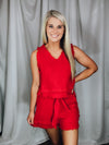 Set offers a solid base color, sleeveless detail, tank and short pieces, frayed lining detail, pockets, tie belt, with a textured look to add the perfect amount of detail. Runs true to size!-RED