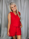 Set offers a solid base color, sleeveless detail, tank and short pieces, frayed lining detail, pockets, tie belt, with a textured look to add the perfect amount of detail. Runs true to size!-RED