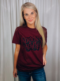 Graphic features a solid base color, short sleeves, unisex fit, black ink design and runs true to size!-maroon