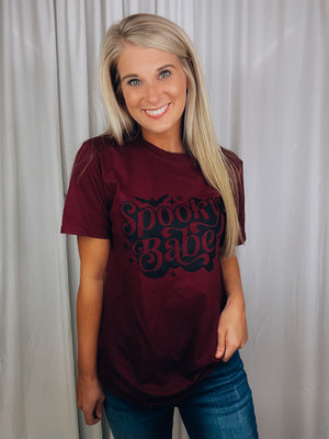 Graphic features a solid base color, short sleeves, unisex fit, black ink design and runs true to size!-maroon