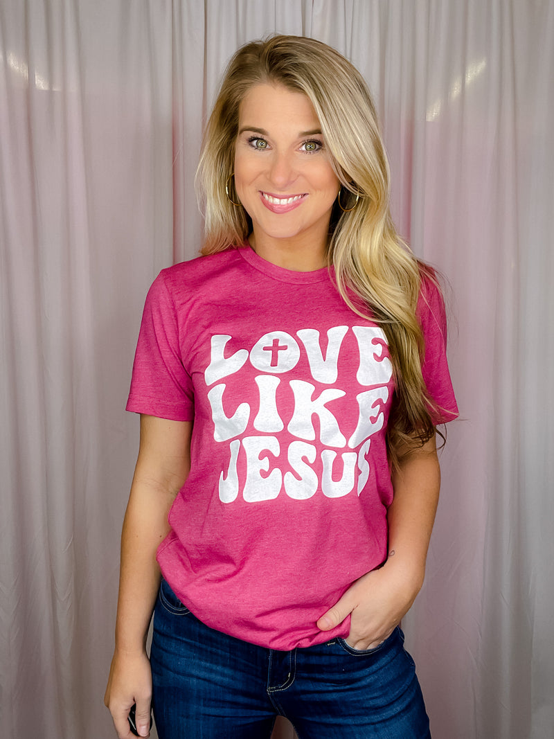 This premium Love Like Jesus Tee is a modern and stylish way to express faith and hope this Easter. Made for a soft and comfortable fit, it features short sleeves, a unisex fit, and a round neck line. With an inspiring "Love Like Jesus" graphic design, it perfectly captures the spirit of the season.-magenta