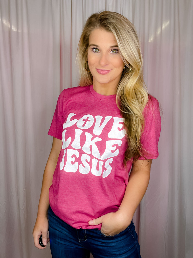 This premium Love Like Jesus Tee is a modern and stylish way to express faith and hope this Easter. Made for a soft and comfortable fit, it features short sleeves, a unisex fit, and a round neck line. With an inspiring "Love Like Jesus" graphic design, it perfectly captures the spirit of the season.-magenta