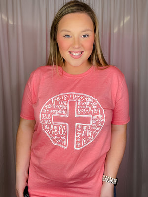 This Scripture Cross Tee is perfect for the Easter season. Its short sleeves, round neck line, and unisex fit make it comfortable and flattering for any body type. The stylish scripture cross design also makes it a great choice for anyone looking for an easy, stylish way to express their faith.-coral