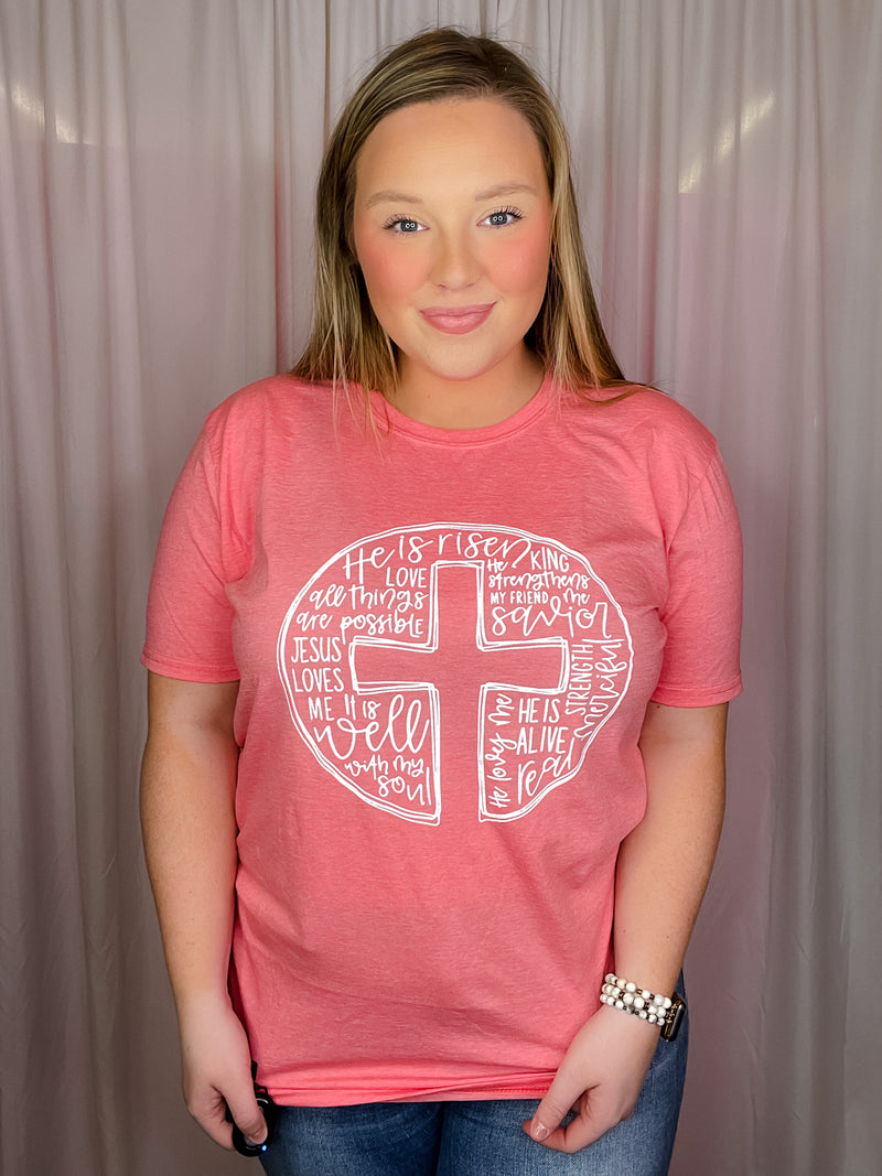 This Scripture Cross Tee is perfect for the Easter season. Its short sleeves, round neck line, and unisex fit make it comfortable and flattering for any body type. The stylish scripture cross design also makes it a great choice for anyone looking for an easy, stylish way to express their faith.-coral