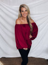 Top features a wine color, peasant sleeves, ruffled detail, elastic waist/ shoulder, loose fit, can be worn on or off the shoulder and runs true to size! 