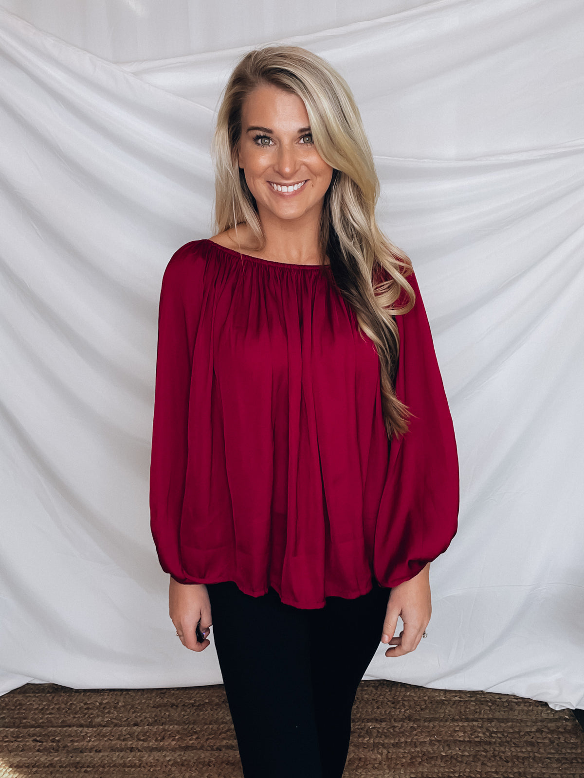 Top features a wine color, peasant sleeves, ruffled detail, elastic waist/ shoulder, loose fit, can be worn on or off the shoulder and runs true to size! 