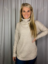 Sweater features a soft waffle knit material, long sleeves, cowl neck line and runs true to size! -oatmeal