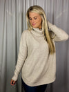Sweater features a soft waffle knit material, long sleeves, cowl neck line and runs true to size! -oatmeal