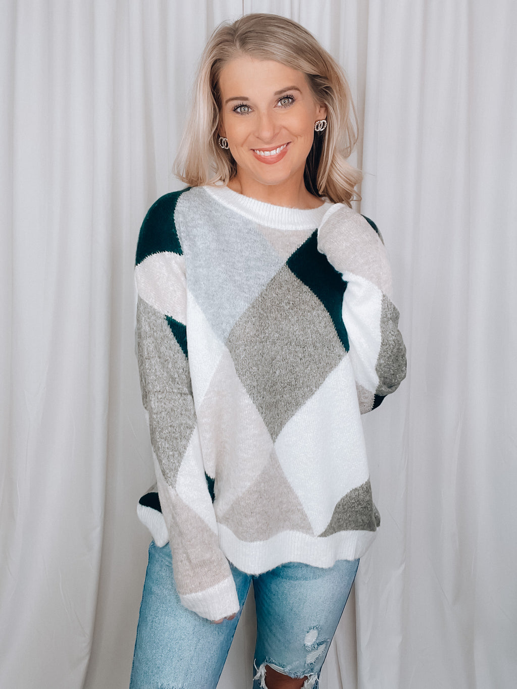 Sweater features a dreamy soft material, long sleeves, diamond pattern with hunter green/olive/grey and taupe tones, color block detail, crew neck line and runs true to size! 