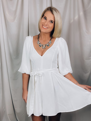 Romper features a solid base color, shoulder pads, short sleeves, V-neck line, tie belt and runs true to size!-white