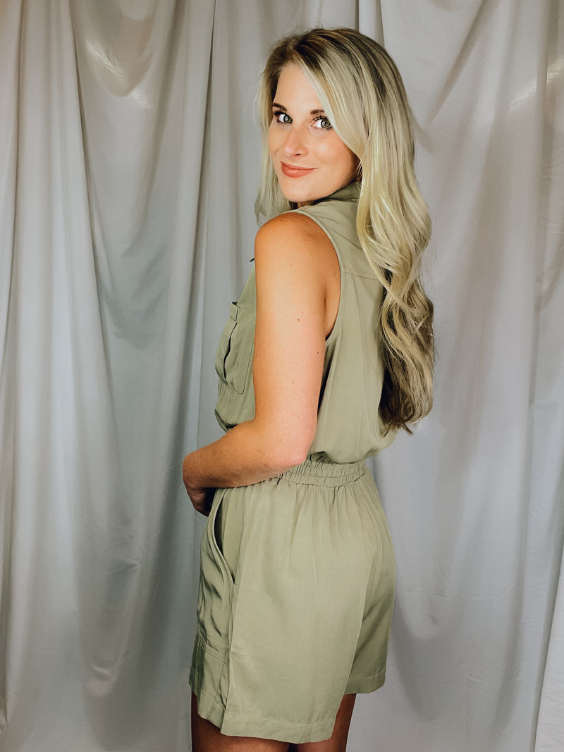 Romper features an olive base, sleeveless detail, tie waist belt, cargo pockets and runs true to size!  Materials: 100% Rayon