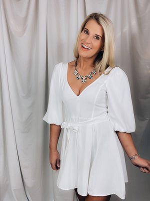 Romper features a solid base color, shoulder pads, short sleeves, V-neck line, tie belt and runs true to size!-white