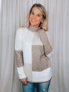 Sweater features a color block detail, long sleeves, dreamy material, mock neck line and runs true to size! 