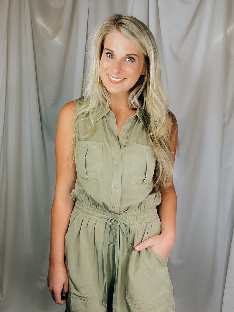 Romper features an olive base, sleeveless detail, tie waist belt, cargo pockets and runs true to size!  Materials: 100% Rayon