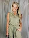 Romper features an olive base, sleeveless detail, tie waist belt, cargo pockets and runs true to size!  Materials: 100% Rayon