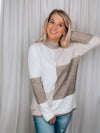 Sweater features a color block detail, long sleeves, dreamy material, mock neck line and runs true to size! 