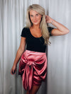 Skirt features a sweet pink color, front tie detail, mini length and runs true to size! 