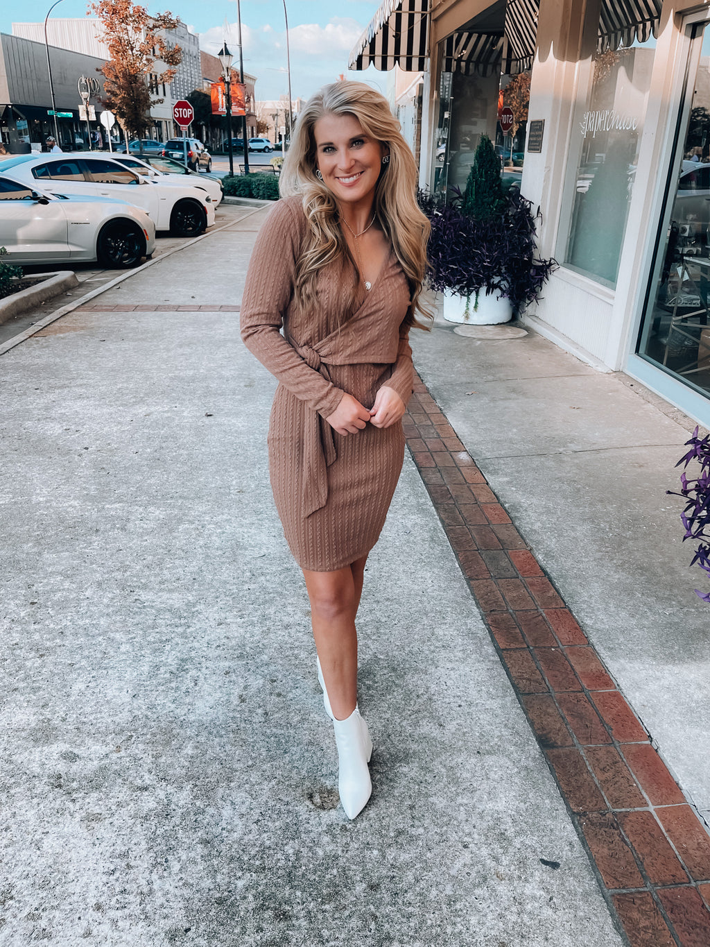 Dress features a solid base color, soft knit material, long sleeves, V-neck line, tie waist band, knee length and runs true to size with a true fitted shape!-mocha