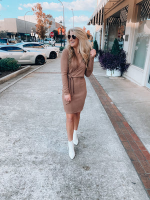 Dress features a solid base color, soft knit material, long sleeves, V-neck line, tie waist band, knee length and runs true to size with a true fitted shape!-mocha