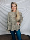 Top features a solid base color, paint stroke design, long sleeves, round neck, light weight material, cinched ruffle sleeves and runs true to size!   100% Polyester -SAGE