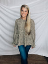 Top features a solid base color, paint stroke design, long sleeves, round neck, light weight material, cinched ruffle sleeves and runs true to size!   100% Polyester -SAGE