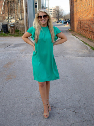 Dress features a solid base color, ruffle short sleeves/ neck, lightweight material and runs true to size! -green