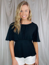 Top features a solid base color, boat neck, short sleeves, ruched front, textured material and runs true to size!-BLACK