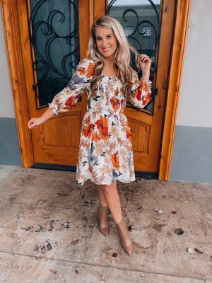 Dress features an ivory base, multi colored floral print design, square neck line, 3/4 sleeves, elastic chest detail, functional pockets and runs true to size! 