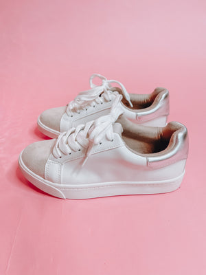 Sneakers feature a white base, lace up detail, memory foam base and runs true to size! 