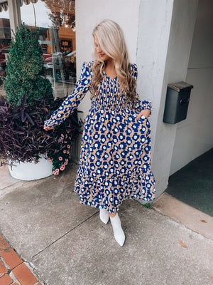 Dress features a stunning floral print, long sleeves, midi length, layered skirt, soft V-neck line and runs true to size! 