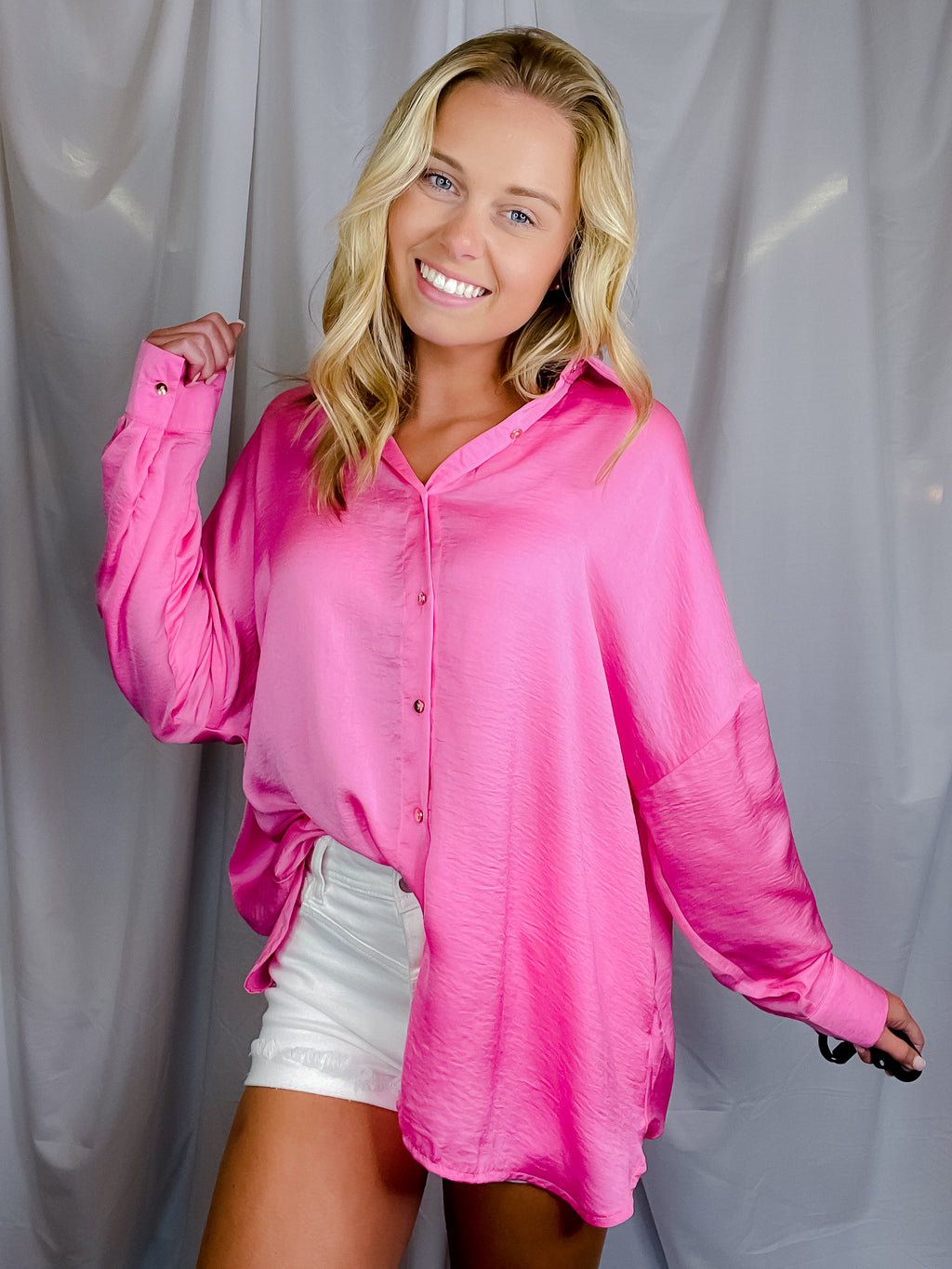 Top features solid base color, long sleeves, button down fit, thin material and runs true to size!-hot pink
