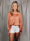 Top features a blush color, off the shoulder detail, tiered look, lightweight and stretchy material, elastic neck/ shoulder and runs true to size!