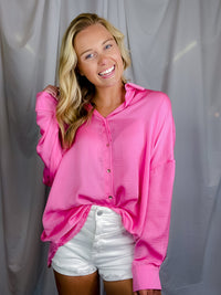 Top features solid base color, long sleeves, button down fit, thin material and runs true to size!-hot pink