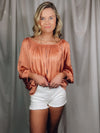 Top features a blush color, off the shoulder detail, tiered look, lightweight and stretchy material, elastic neck/ shoulder and runs true to size!