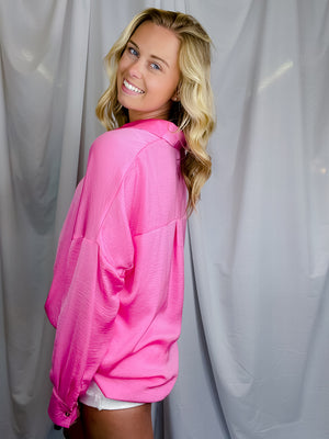 Top features solid base color, long sleeves, button down fit, thin material and runs true to size!-hot pink