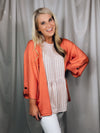 Cardigan offers a quarter sleeve, button detail, open front, sleeves and runs true to size!-coral