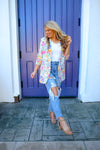 Blazer features an ivory base, vibrant colors, floral print design, 3/4 sleeve, open front detail and runs true to size! 