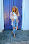 Blazer features an ivory base, vibrant colors, floral print design, 3/4 sleeve, open front detail and runs true to size! 