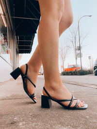 The Slip Into Style Heels offer a compelling option for formal occasions. Featuring a stylish strap detail, a sleek small heel and a sophisticated finish, they're perfect for weddings and everyday wear. Experience the elegance and ease of a soft and comfortable fit, creating the perfect look for any event.-black