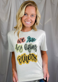 We Rise By Lifting Others Tee (S-2XL)