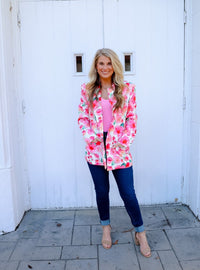 Blazer features a fun pink and white floral detail, long sleeves, collared detail, functional pockets, underlining detail, shoulder pads and runs true to size!