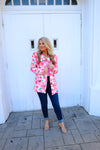 Blazer features a fun pink and white floral detail, long sleeves, collared detail, functional pockets, underlining detail, shoulder pads and runs true to size!