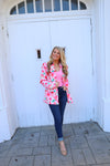 Blazer features a fun pink and white floral detail, long sleeves, collared detail, functional pockets, underlining detail, shoulder pads and runs true to size!